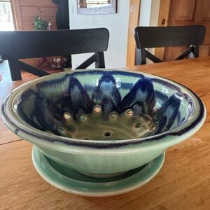 Beautiful berry bowl. Like new! Aeration holes with blue and green design.